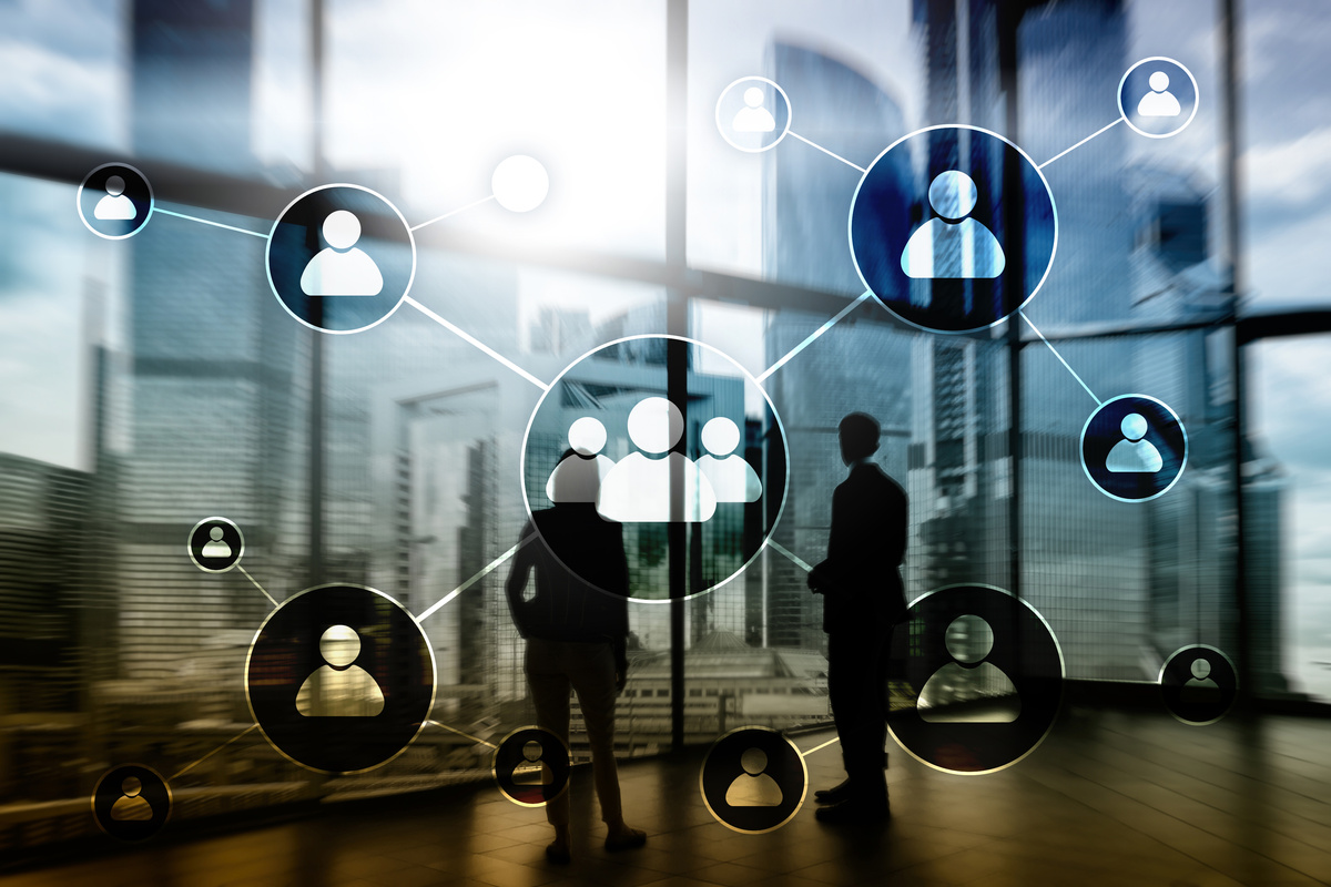 HR - Human resources management concept on blurred business center background.